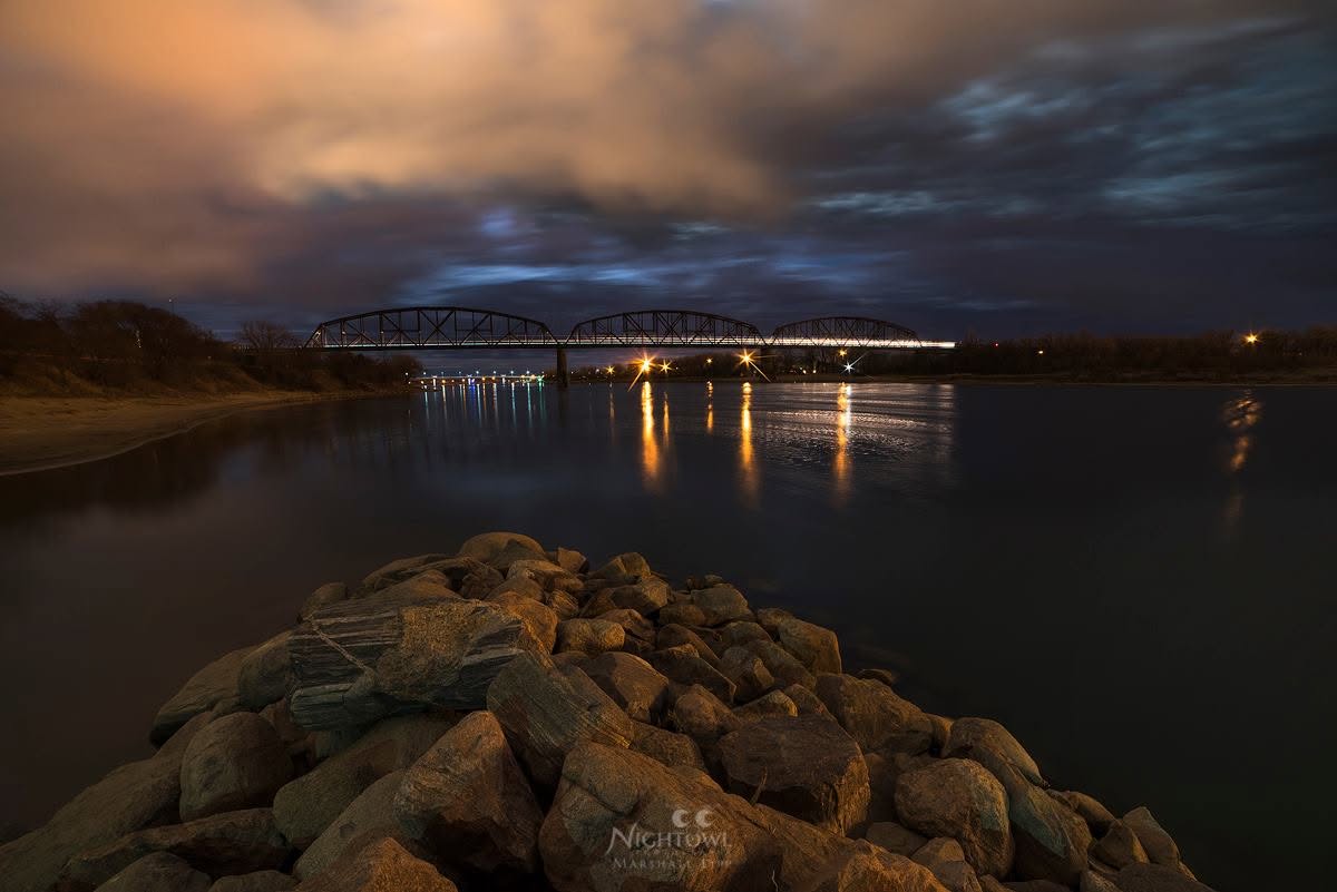 Nightfall beyond the rocky shore