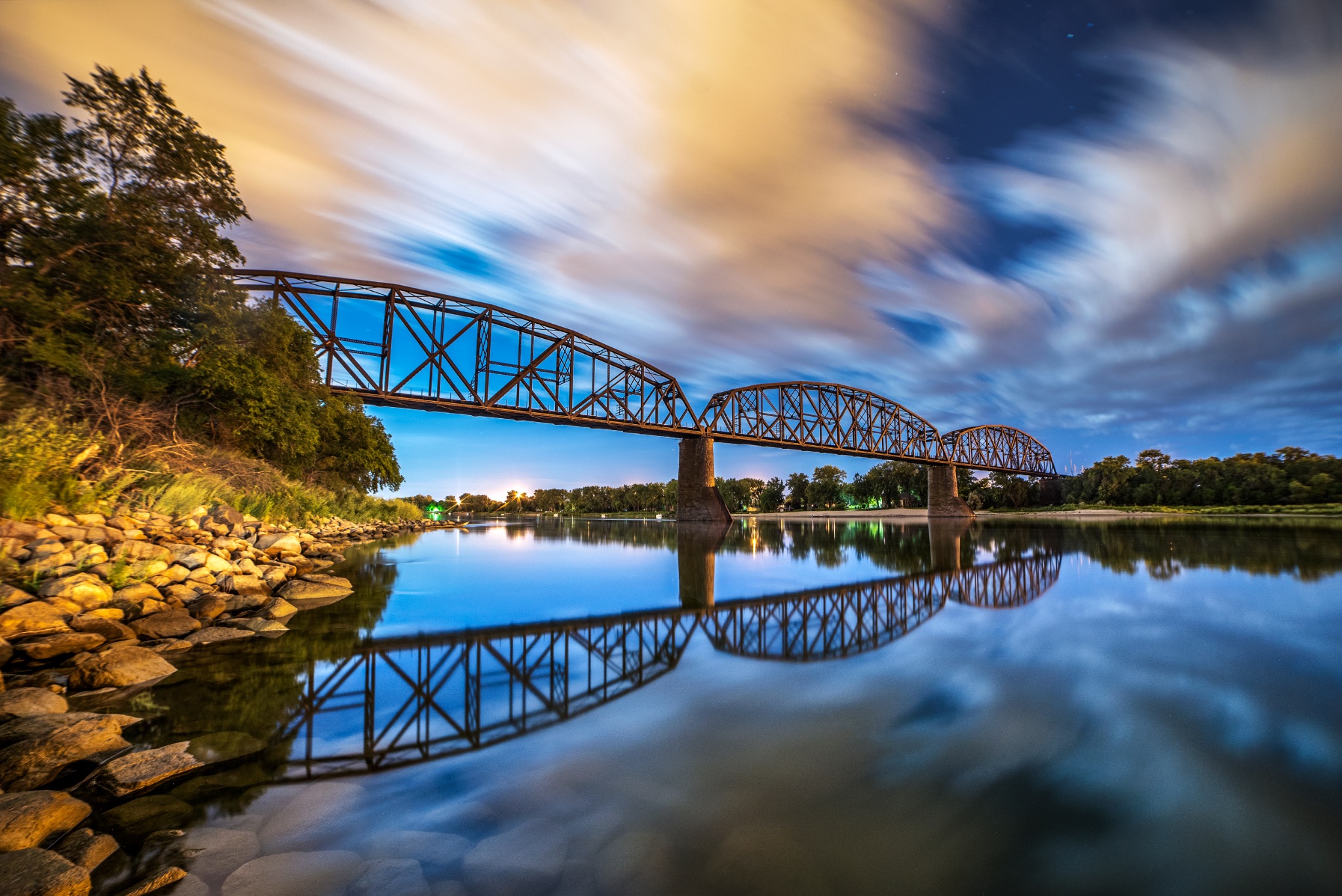 Clouds reflected below the bridge