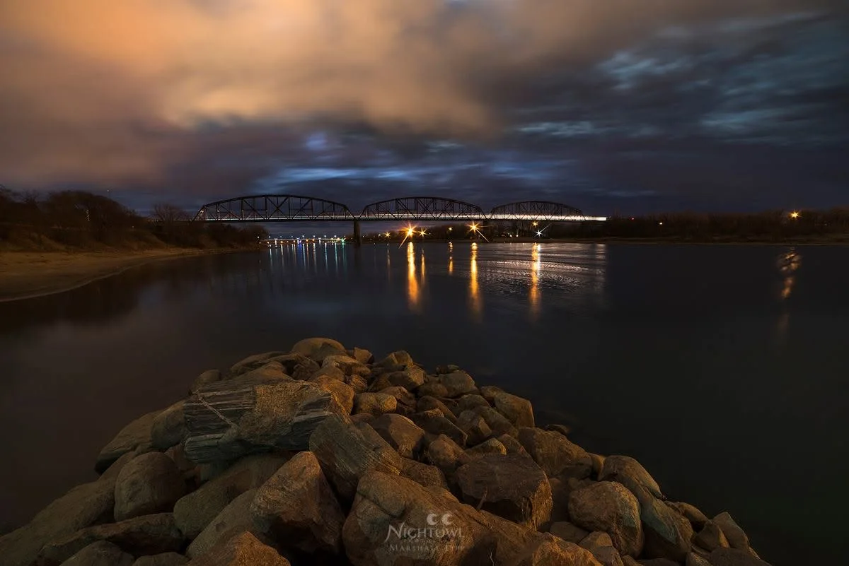 Nightfall beyond the rocky shore