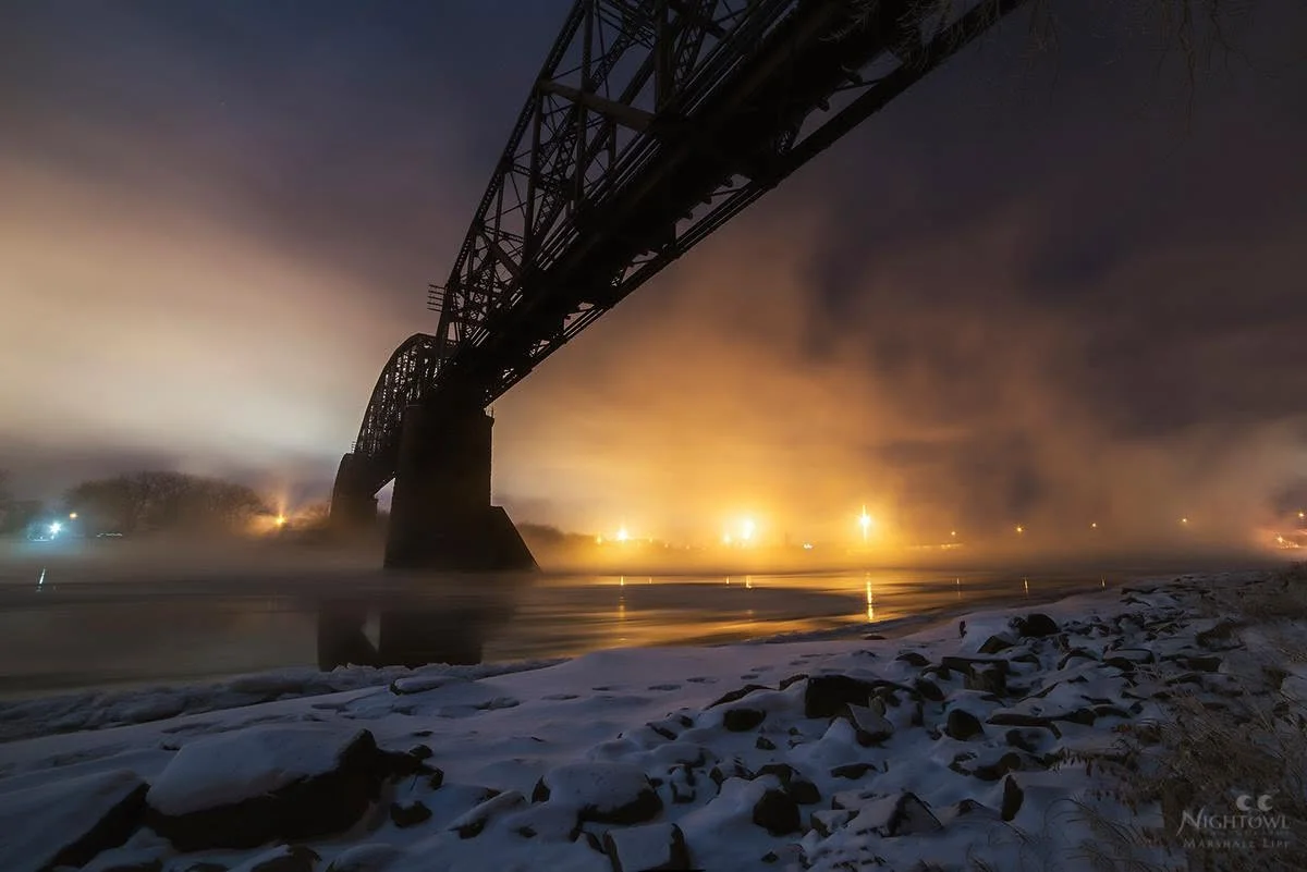 Winter fog beneath the steel span