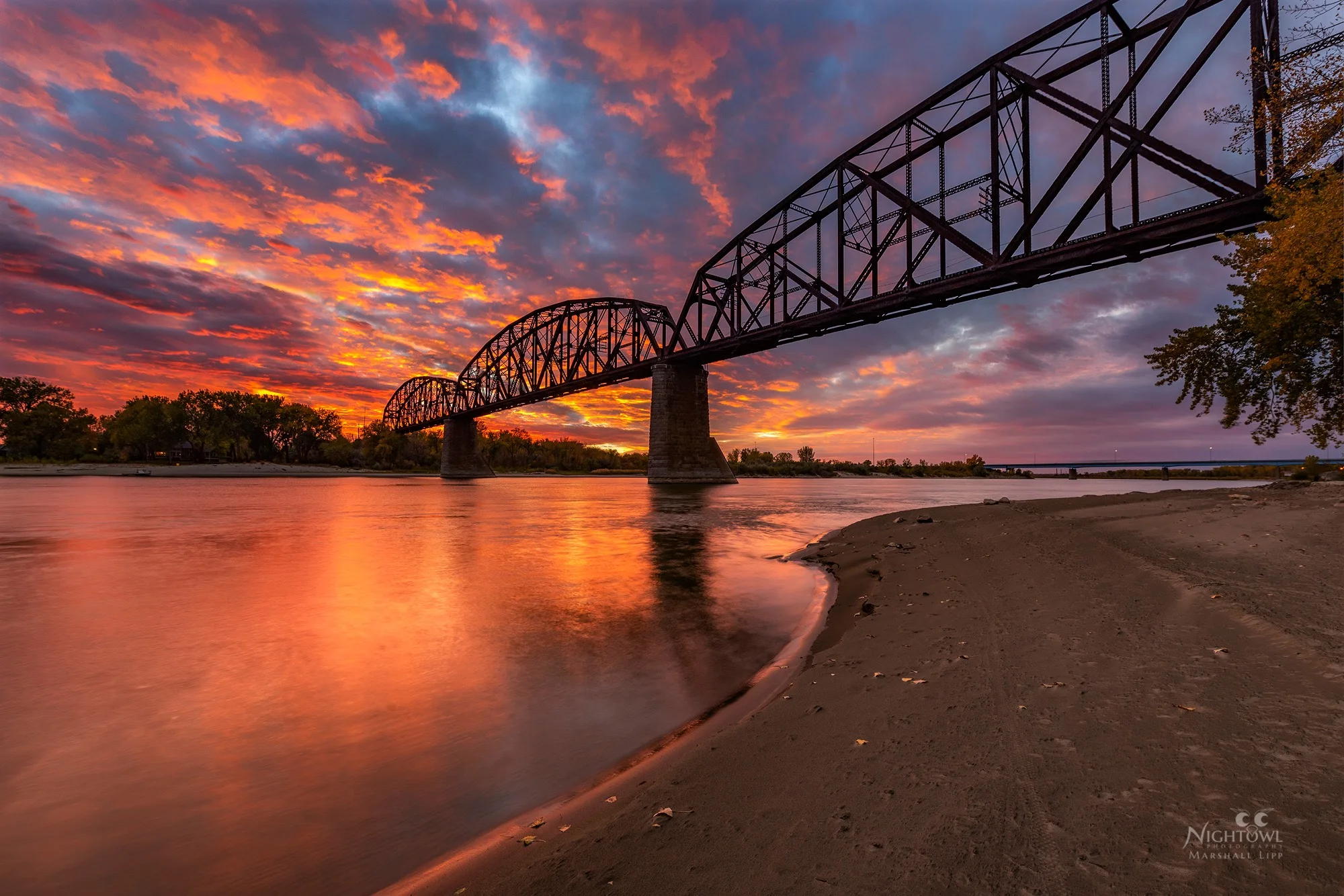 Sunset behind the train bridge